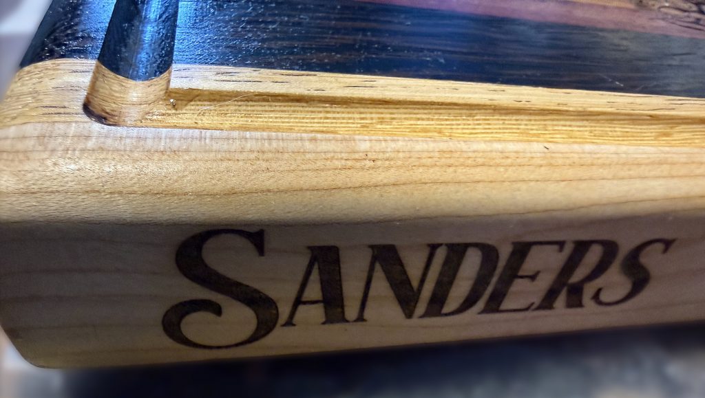 Brooks hardwood cutting board with laser-burned engraved personalization detail