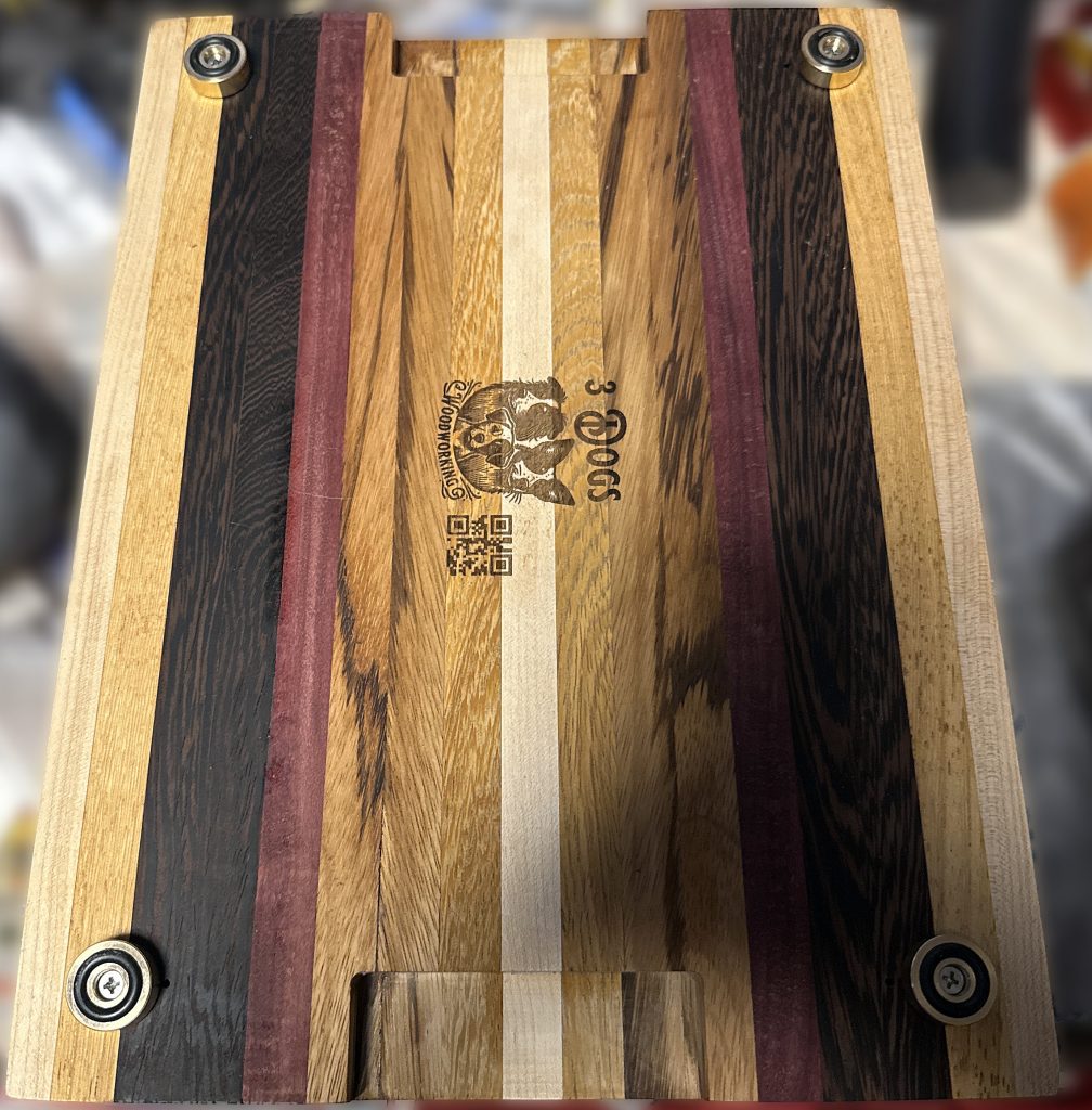custom hardwood cutting board with brass non-slip feet and 3 Dogs Woodworking logo