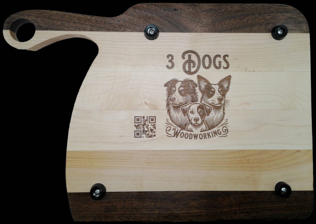 Custom hardwood cutting board with engraved 3 Dogs Woodworking logo and QR code, handcrafted striped maple and walnut kitchen board