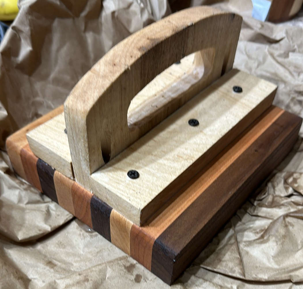 SmashMaster handcrafted hardwood burger press with contrasting wood layers and an ergonomic handle