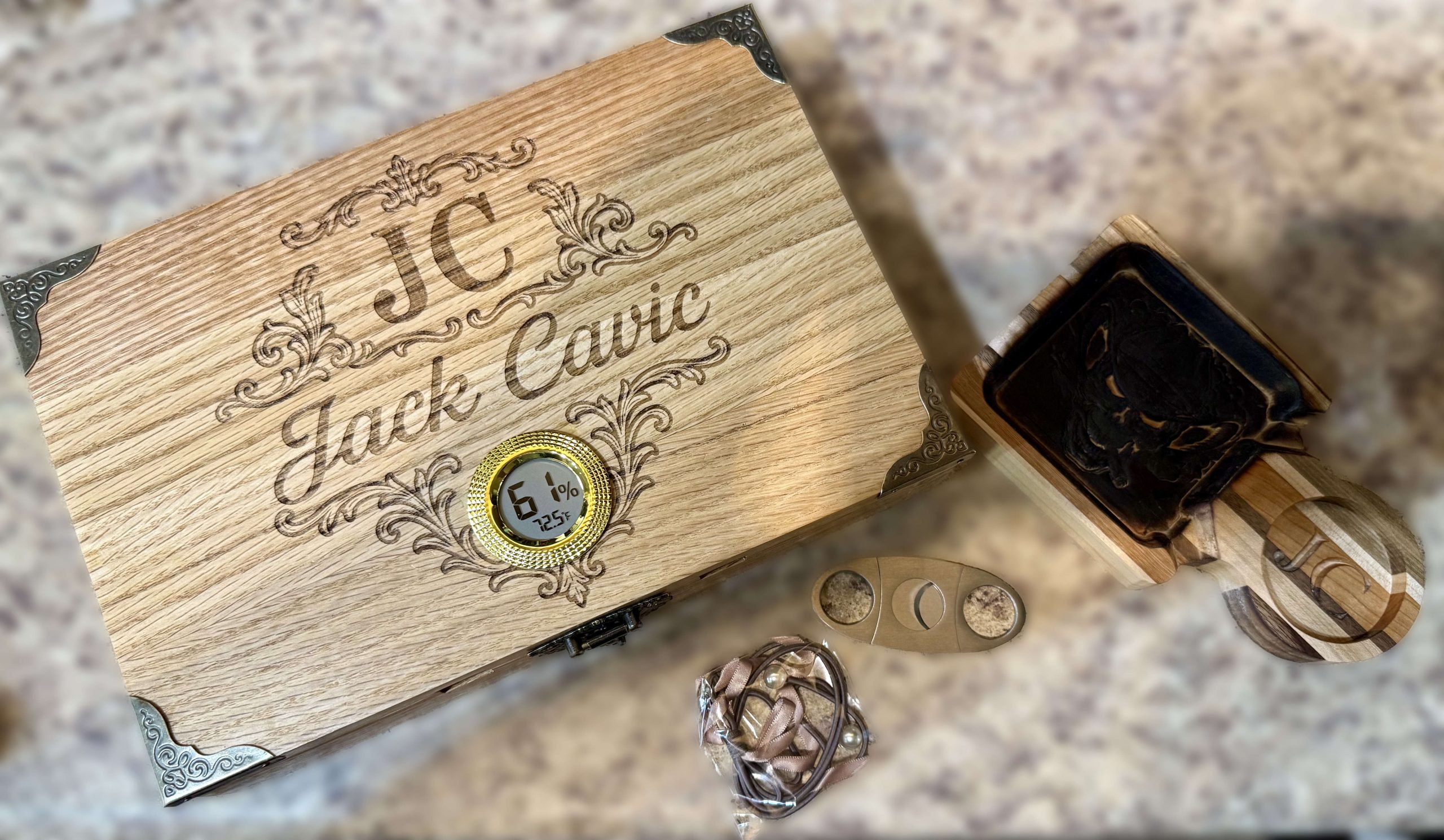 Personalized hardwood cigar humidor gift set with engraved lid, handmade ashtray, cutter, and lighter