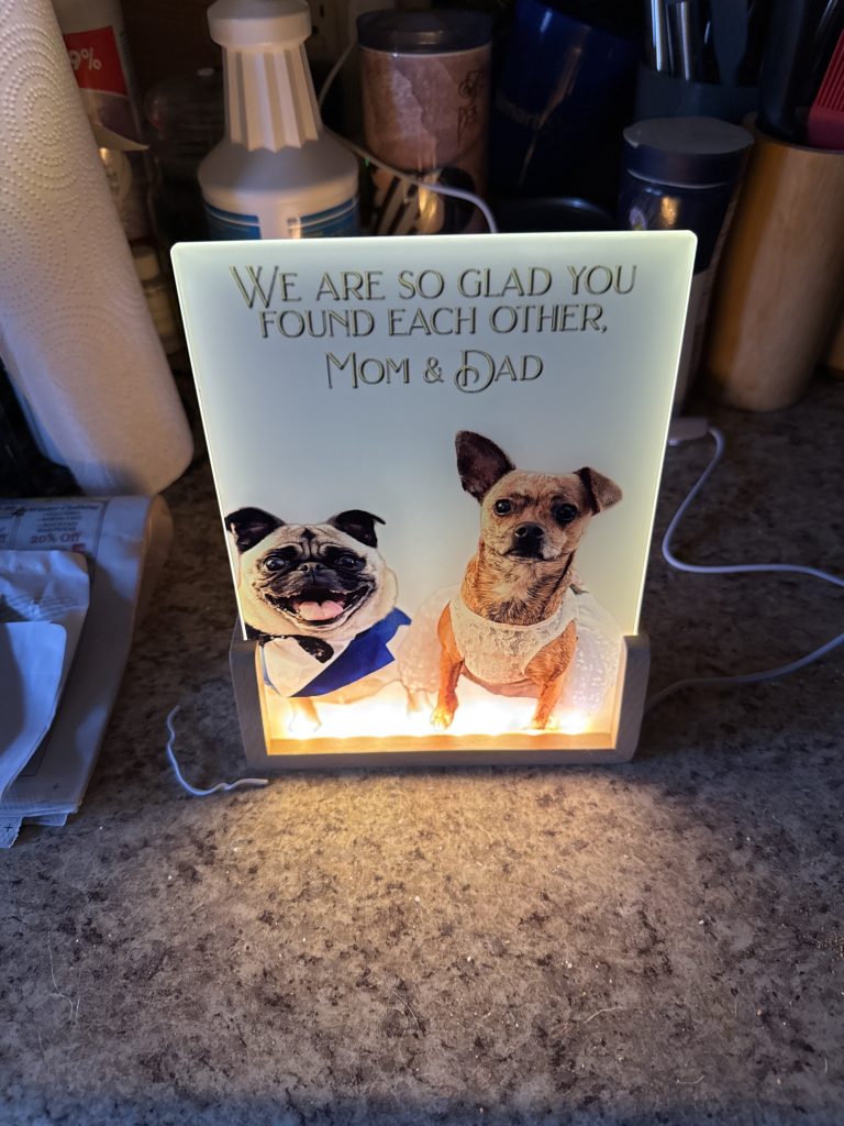 Custom woodworking projects and specialty builds by 3 Dogs Woodworking, including signage, memorial displays, kitchen tools, leash holders, décor pieces, and mixed-material designs in hardwood, cedar, HDPE, and other materials.