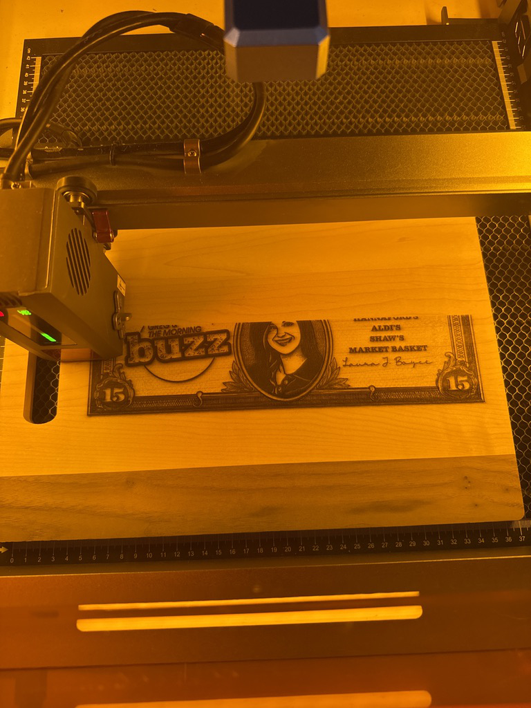 Custom “Cooking on a Budget” cutting board being laser engraved on the Genmitsu L8 laser at 3 Dogs Woodworking.