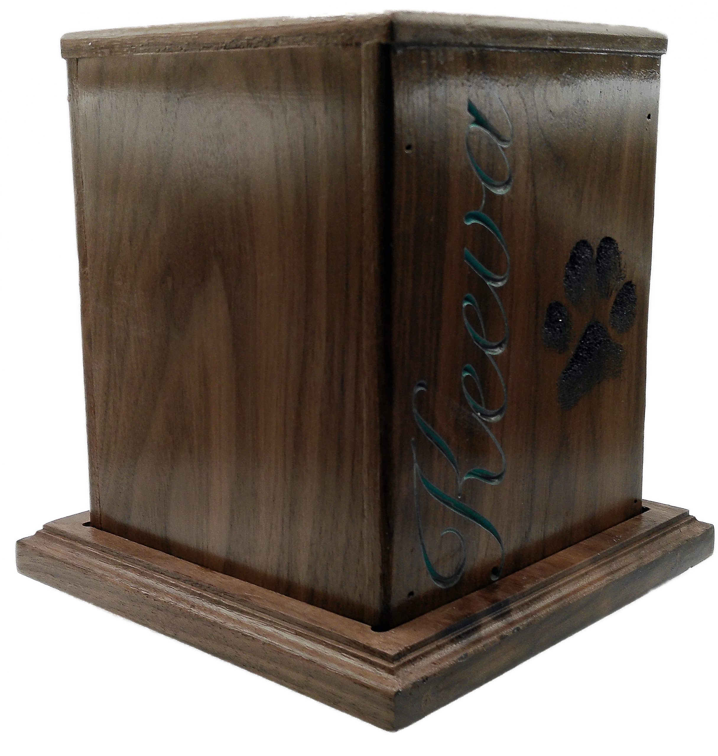 Handcrafted walnut custom dog memorial urn honoring Keeva with turquoise engraved name and life-size paw print.