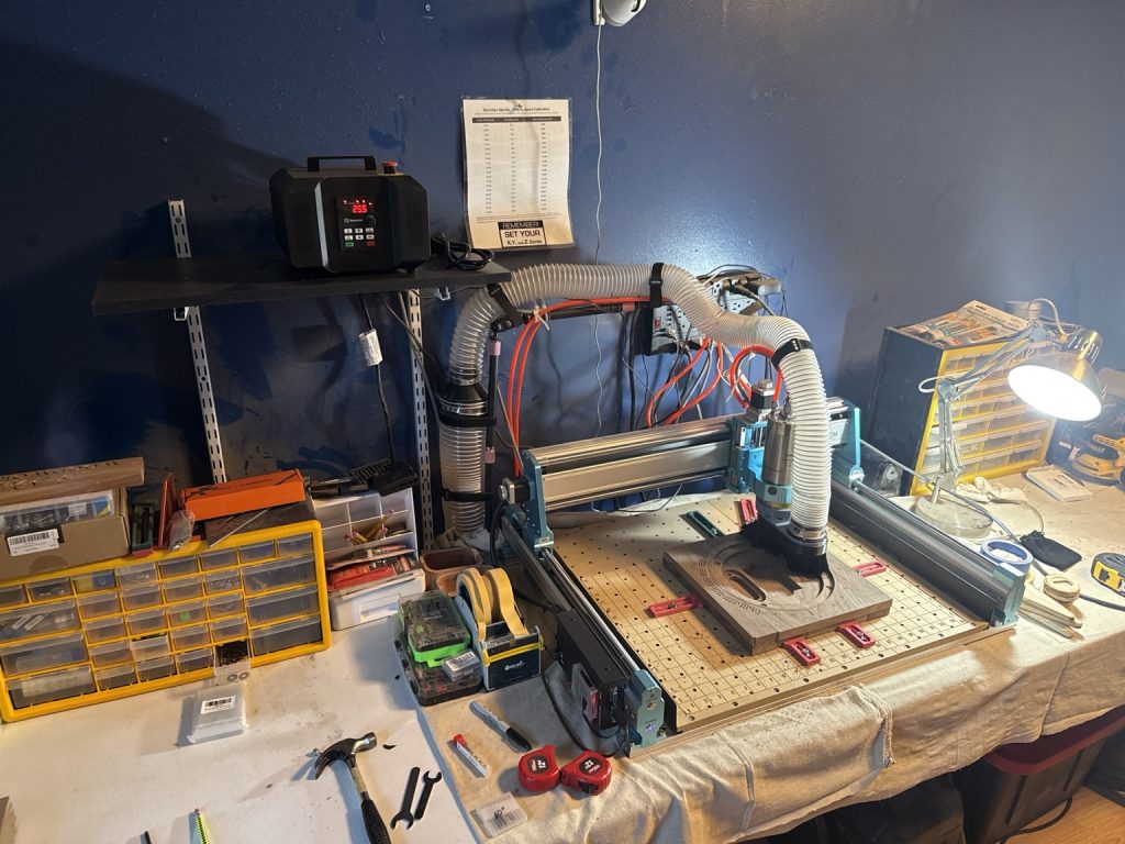 CNC machine cutting a woodworking project with a CIC Workshop bit